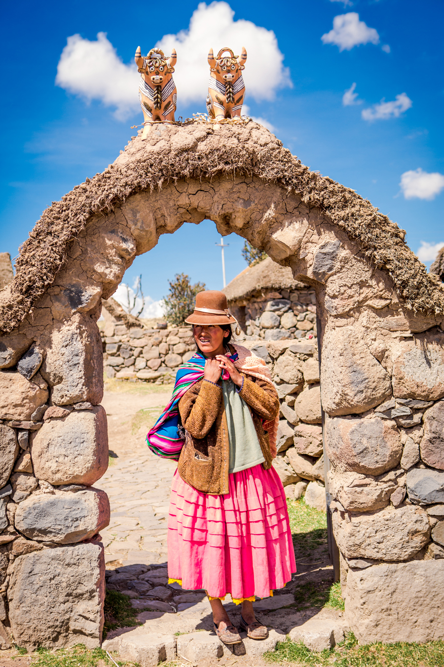 Woman Under a Stone Arch in Peru