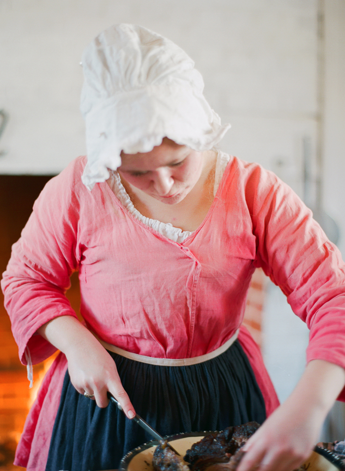 Woman Carving Meat in Colonial Williamsburg