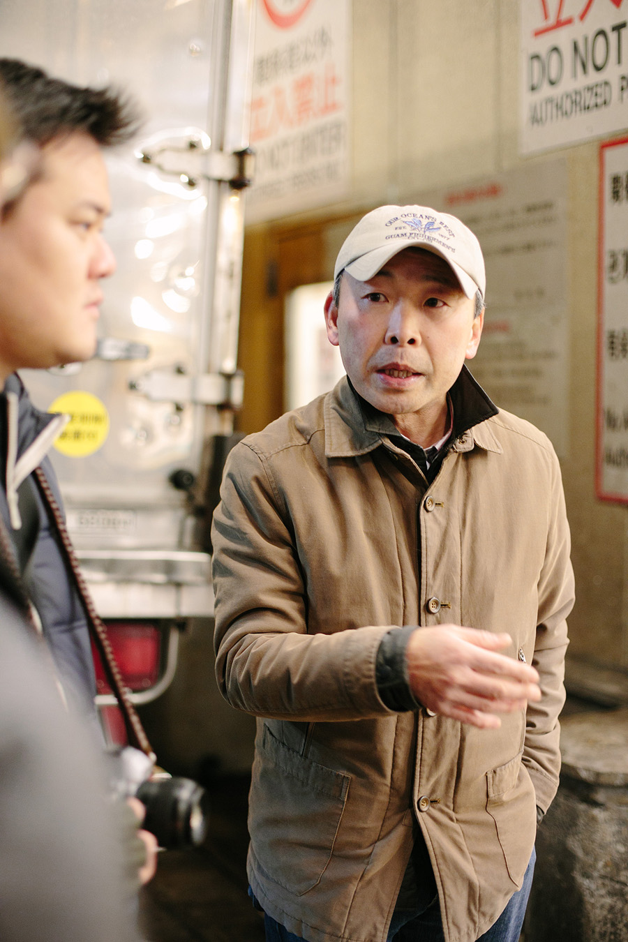 Guide at Tsukiji Fish Market in Tokyo Guide at Tsukiji Fish Market in Tokyo
