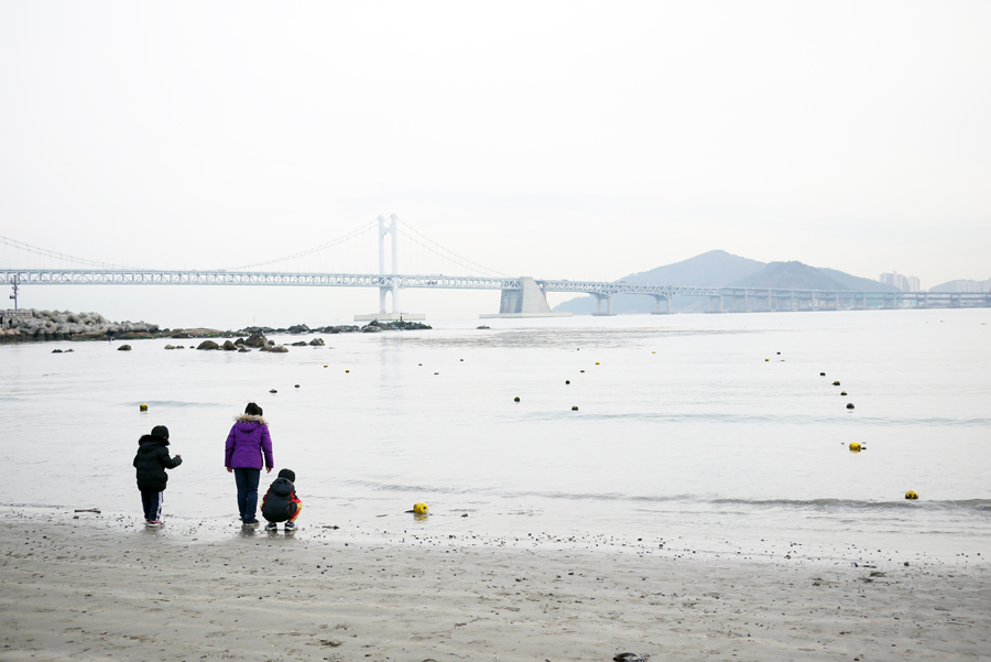 Children Playing in the Haeundae District Waterfront Children Playing in the Haeundae District Waterfront