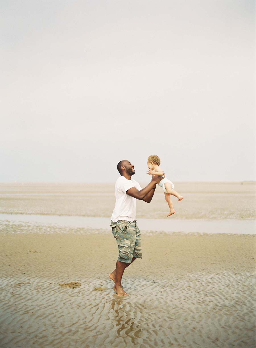 Dad and Child Playing on Hunstanton Beach