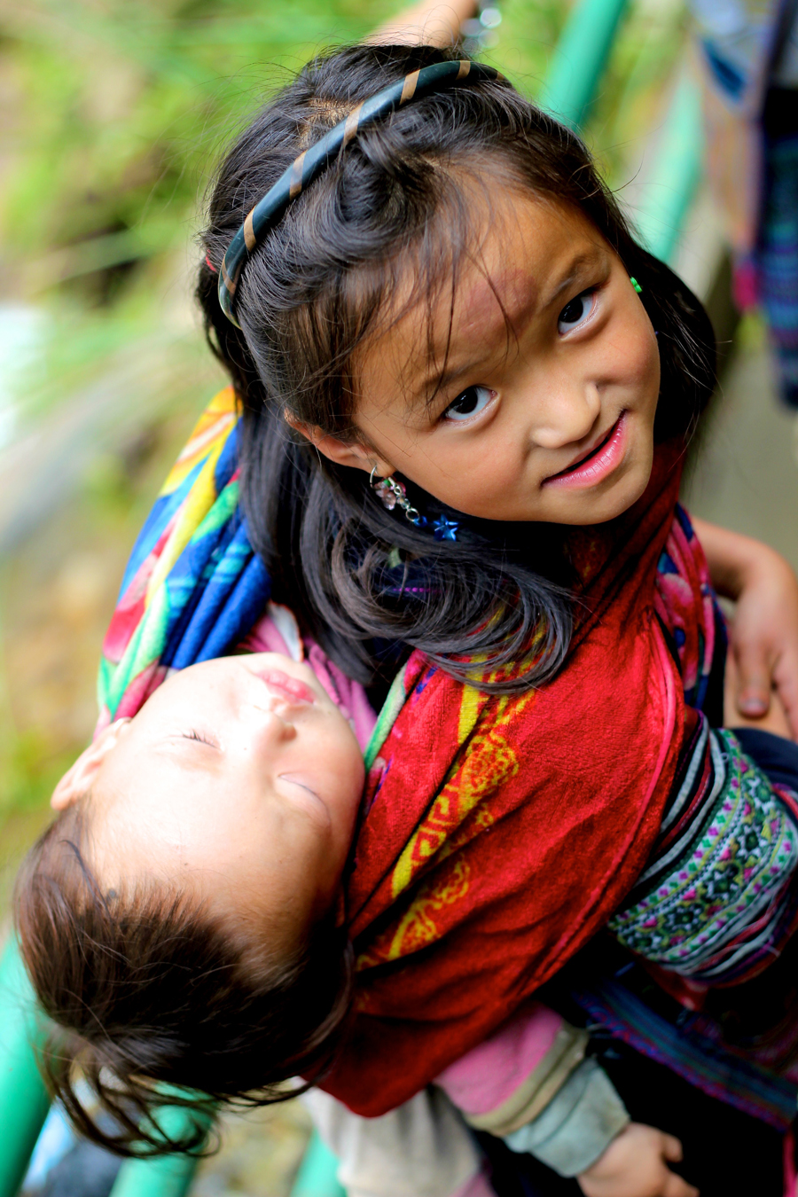 Young Girl Carrying Child in Sapa Vietnam