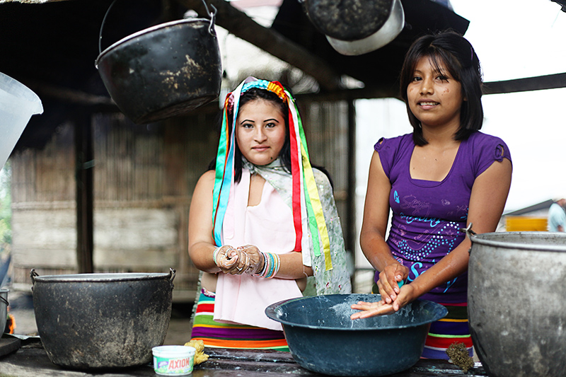 Young Girls Cooking in Tsachilas Ecuador