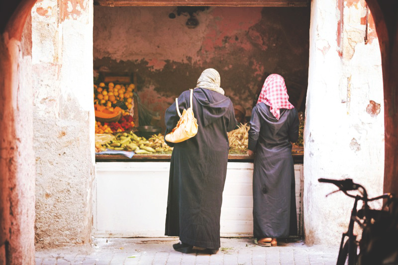 Women Buying Fruit at the Marrakech Medina Market