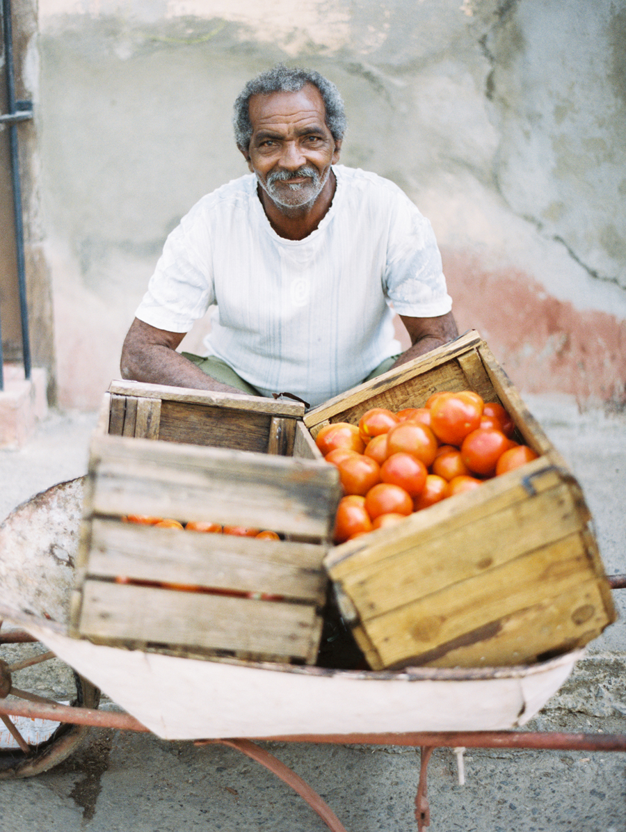 Man Selling Tomatoes in Cuba Man Selling Tomatoes in Cuba