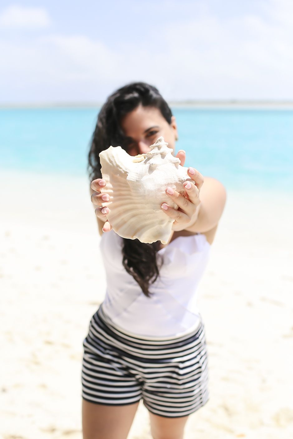 Woman Holding Conch Shell in Turks and Caicos