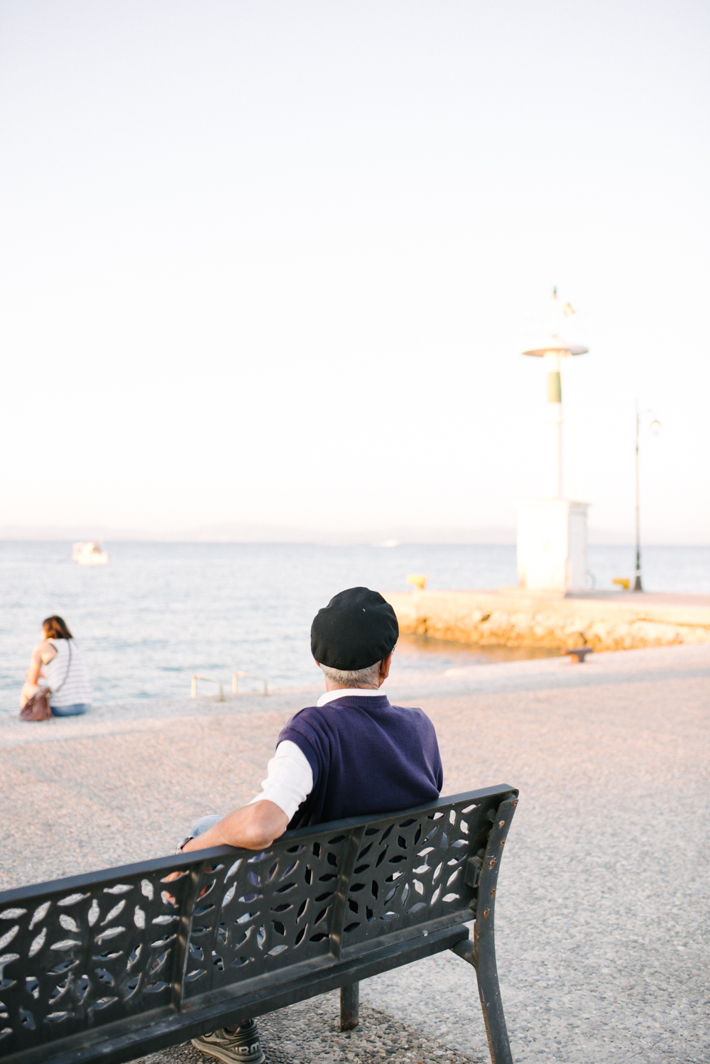 Man Relaxing on Bench in Kos Island Greece